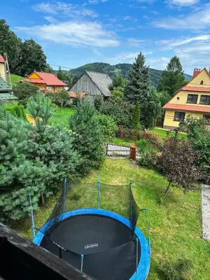 a trampoline in the backyard of a house at Agroturystyka Górski Wypoczynek in Stryszawa