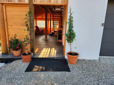 a hallway of a house with potted plants at Apartament u Ewki in Rdzawka