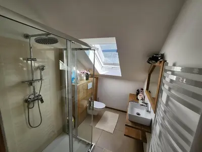 a bathroom with a shower and a sink at Apartament u Ewki in Rdzawka