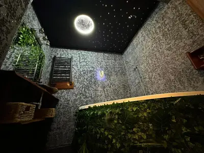 a room with a ceiling with a moon on it at Tropicana Jacuzzi Apartment in Kraków