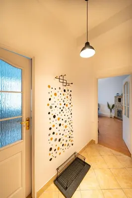 a room with a wall with a bunch of spheres at Urocze mieszkanie w krakowskiej kamienicy in Kraków