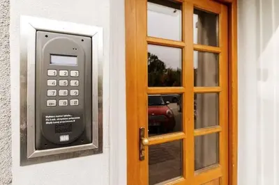 a door with a parking meter next to a glass door at Urocze mieszkanie w krakowskiej kamienicy in Kraków