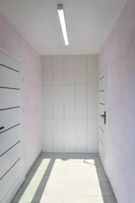 an empty room with white walls and a door at KempingZator in Zator