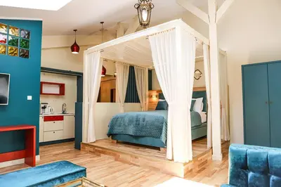 a bedroom with a canopy bed in a room at Main Square Platan Loft Collection in Kraków