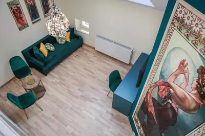 an overhead view of a living room with a painting at Main Square Platan Loft Collection in Kraków