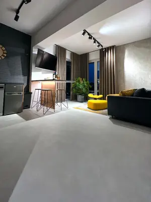 a living room with a couch and a table at Prestige 12 in Zator