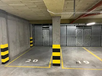 an empty parking garage with parking spaces at Prestige 12 in Zator