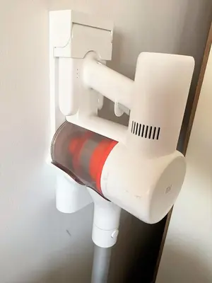 a white toilet with a pipe in a bathroom at A modern apartment for 2 people in Kraków