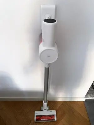 a white toilet in the corner of a wall at A modern apartment for 2 people in Kraków
