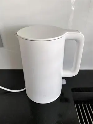 a white bucket sitting on top of a counter at A modern apartment for 2 people in Kraków