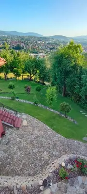 a view of a park with a bench and a field at Mieszkanko z tarasem in Limanowa