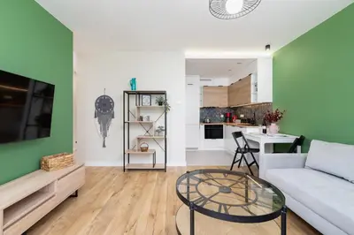 a living room with a couch and a table at Modern Apartment on Łobzowska Street by Noclegi Renters in Kraków