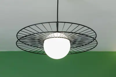 a ceiling light with a white light in a room at Modern Apartment on Łobzowska Street by Noclegi Renters in Kraków