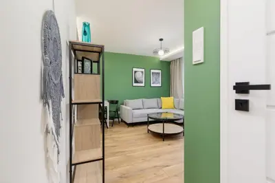 a living room with a couch and a table at Modern Apartment on Łobzowska Street by Noclegi Renters in Kraków