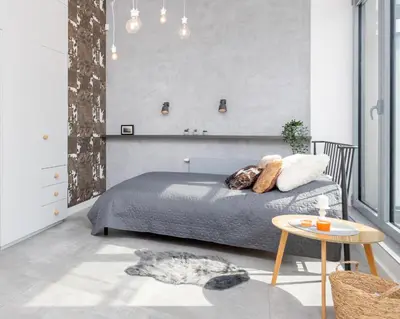 a kitchen with white cabinets and a table with oranges on it at Kraków Loft in Kraków