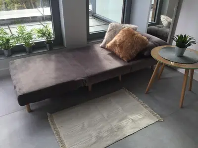 a living room with a bench and a table at Kraków Loft in Kraków