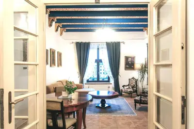 a living room with a table and a couch at Pod Słońcem - Rynek Główny in Kraków