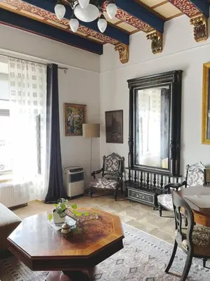 a living room with a coffee table and a couch at Pod Słońcem - Rynek Główny in Kraków