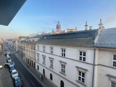 a view of a city street with a white building at Apartment Ida, Kazimierz center in Kraków