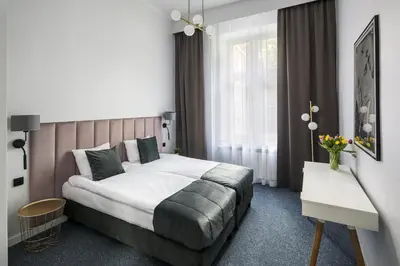 a hotel room with a bed and a window at Modern & cozy flat - near to Wawel Castle in Kraków