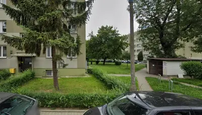 two cars parked in front of a building at Na Szaniec 17 by Homeprime in Kraków