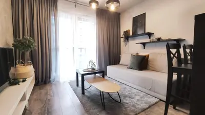 a small living room with a couch and a table at Wrocławska 53L by Homeprime in Kraków