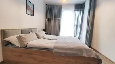 a bed in a room with a window at Wrocławska 53L by Homeprime in Kraków