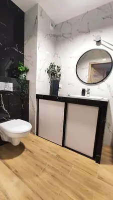 a bathroom with a sink and a toilet and a mirror at Wrocławska 53L by Homeprime in Kraków