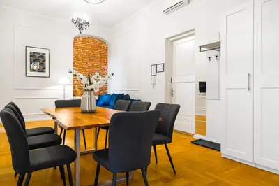 a dining room with a table and chairs at Glamorous Apartment in heart of Old Town in Kraków