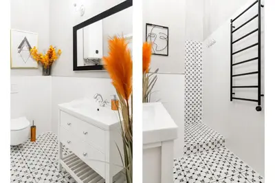 a white bathroom with a sink and a mirror at Glamorous Apartment in heart of Old Town in Kraków