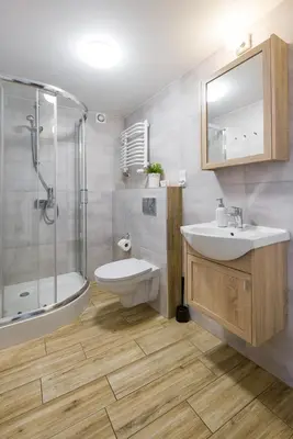a bathroom with a sink and a shower and a toilet at Near the Royal Castle in Kraków