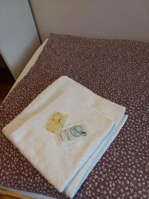 a bed with two towels on top of it at Mieszkanie na Mickiewicza 7 in Olkusz