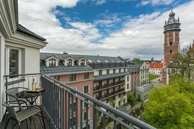 a balcony with a view of a city at Premium Penthouse Apartment in Kraków