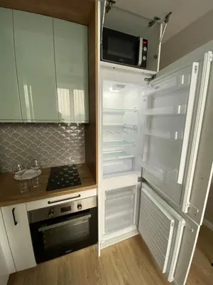an empty refrigerator with its door open in a kitchen at Green Residence Orawska 5 in Kraków
