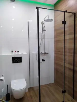 a bathroom with a toilet and a shower at Apartament Premium 72 in Zator