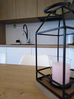 a candle holder on a table in a kitchen at Apartament Premium 72 in Zator