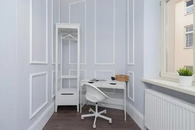 a room with a desk and a chair at Perła Starego Miasta Kamienica Czapskich by Noclegi Renters in Kraków