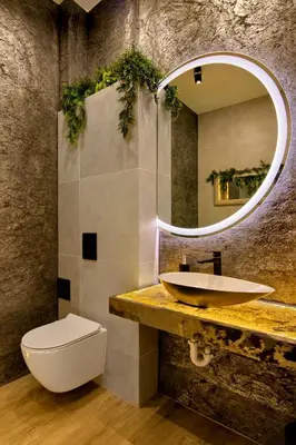 a bathroom with a sink and a toilet and a mirror at Silver Shine jacuzzi in Kraków