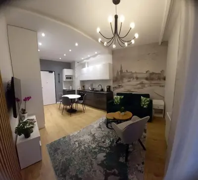 a living room with a couch and a table at krakow dream apartment in Kraków