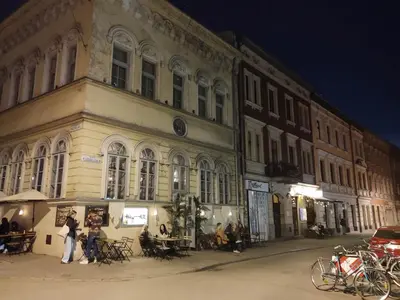 a group of people standing in front of a building at Little Big BC - Central Modern Studio in Kraków