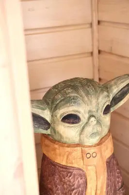a statue of the baby yoda on a building at Chatki Osada Babia Raj Zawoja in Zawoja