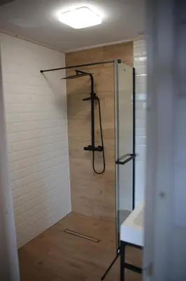 a shower with a glass door in a bathroom at Chatki Osada Babia Raj Zawoja in Zawoja