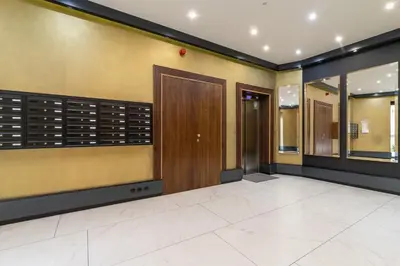 a lobby with a door and a walk in closet at Modern Apartment Cracow Old Town by Noclegi Renters in Kraków