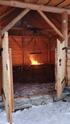 a fire in a barn with a chandelier at Domek w górach pod Jodłami in Nowy Targ