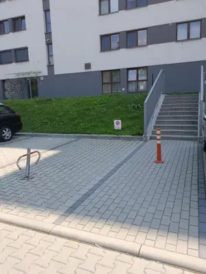 a parking lot in front of a building at Sołtysowska Apartment in Kraków