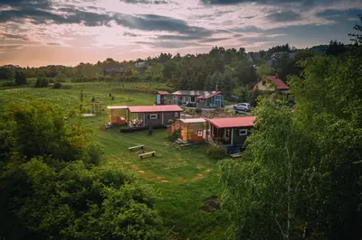 an aerial view of a group of houses in a field at Domki na Górniej Łące - Dwa Wróble in Łazany