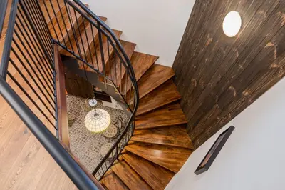 an overhead view of a spiral staircase with wood at Apartament Podskalański in Szyce