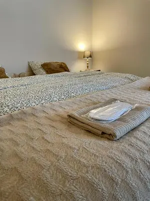 a bed with a blanket on top of it at Przyszowa 441 in Przyszowa