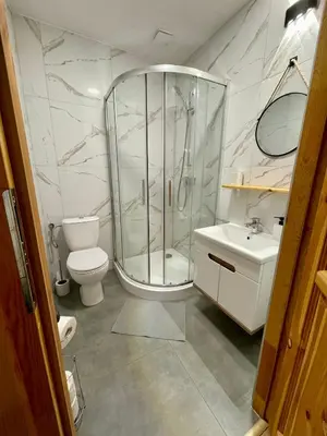 a bathroom with a shower and a toilet and a sink at Przyszowa 441 in Przyszowa