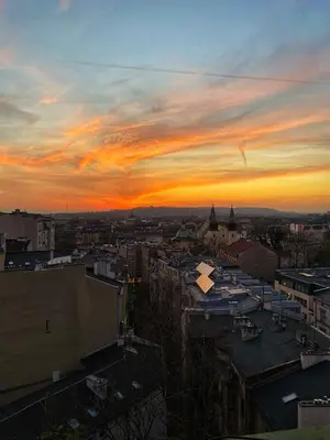 a view of a city at sunset at Best View Old Town Rooms in Kraków